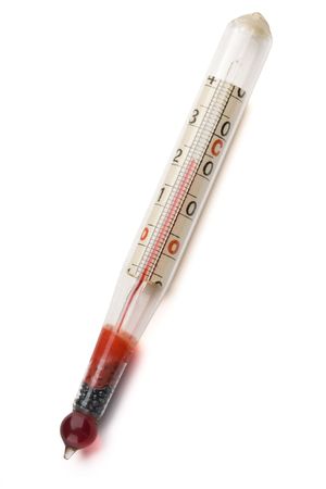 a vintage mercury thermometer on white