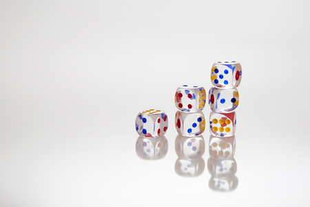 transparent dices on the white background with reflectionの写真素材