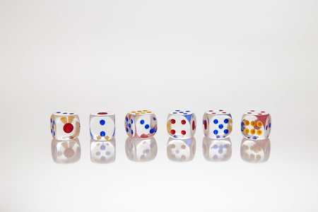 transparent dices on the white background with reflectionの写真素材