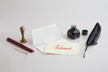 Paper with envelope, quill pen, inkwell and sealの写真素材