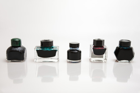 Five kind of inkwells with different design with white backgroundの写真素材
