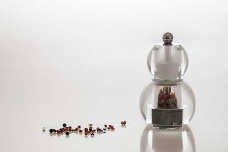 Transparent modern grinder with pepper mix and saltの写真素材