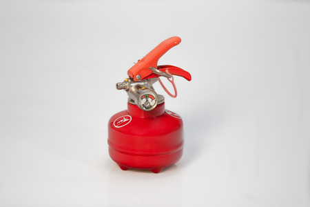 Small or pocket fire-extinguisher mashine with red colorの写真素材
