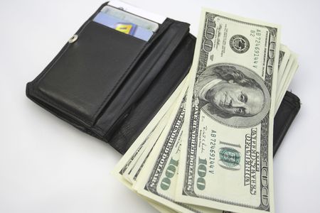 wallet and money on the white backgroundの写真素材