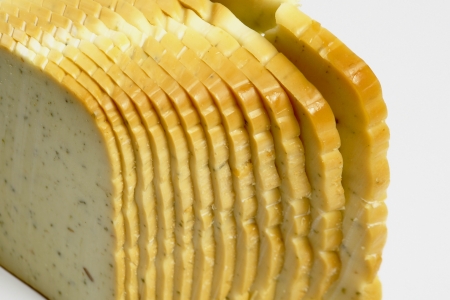 slices of cheese on the white backgroundの写真素材