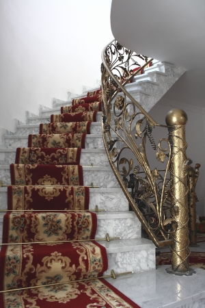 marble stairs and gold balustradeの写真素材