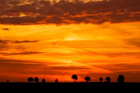 Landscape photographed during vivid sunset over tranquil countrysideの写真素材