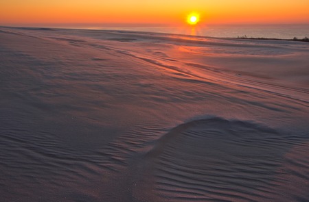 Sand dunes at sunrise, photographed in Slowinski National Park in Polandの写真素材