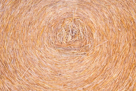 Straw bale structure in close up, useful as agricultural backgroundの写真素材