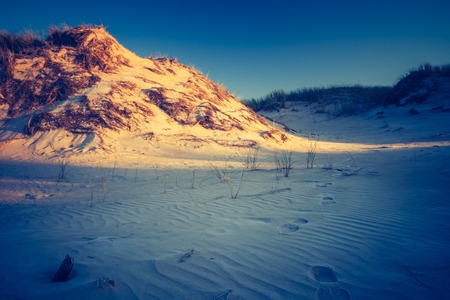 Sand dunes landscape in Slowinski National Park in Poland. Photo with vintage mood