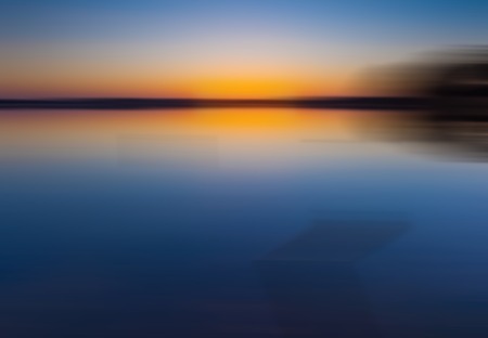 Blurry and defocused landscape useful as background. Nature scene with some out of focus rural landscape with nice light.の写真素材