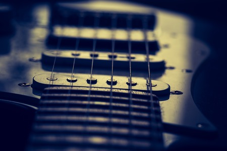 Close up of electric guitar element. Abstract photo.