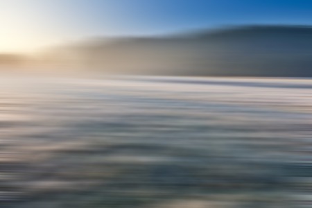 Blurry, defocused field landscape useful as background. Out of focus landscape.の写真素材