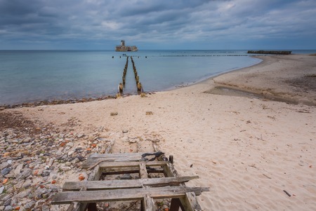 Beautiful view on Baltic sandy coast with old military buildings from world war II and wooden breakwaters.の写真素材