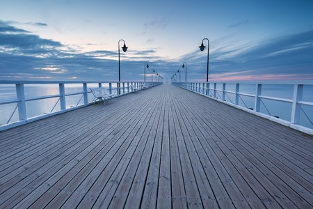 Beautiful long exposure seascape with wooden pier. Pier in Orlowo, Gdynia in Poland.の写真素材