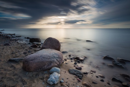 Rocky sea shore. Long exposure photo. Baltic sea shore.の写真素材