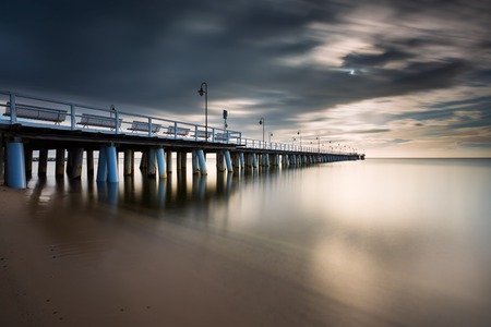 Beautiful long exposure seascape with wooden pier. Pier in Orlowo, Gdynia in Poland.の写真素材