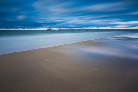 Beautiful sandy sea shore. Baltic sea. Long exposure photo.の写真素材