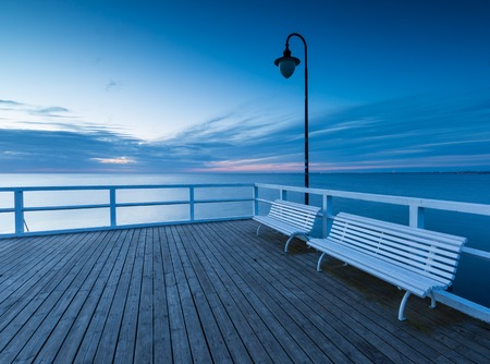 Beautiful morning seascape with wooden pier. Pier in Orlowo, Gdynia in Poland.の写真素材