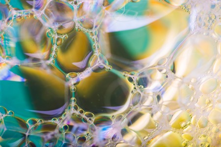 Close up of froth, abstract background. Air bubbles in soap foam.の写真素材