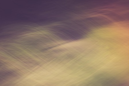 Vintage photo of blurry abstract background of green summer forest photographed on long exposure...
