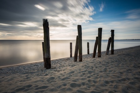 Beautiful piece of old destroyed pier in Gdynia, poland. Seascape with wooden molo in Orlowo.の写真素材