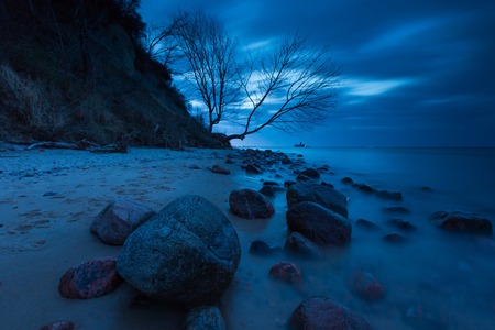 Baltic shore near Gdynia. Beautiful dramatic weather seascape of polish shore of Baltic sea photographed at night.の写真素材