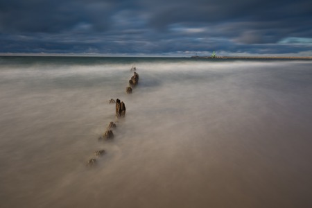 Baltic shore. Beautiful dramatic weather seascape of polish shore of Baltic sea and mouth of Vistula river in Gdansk.の写真素材