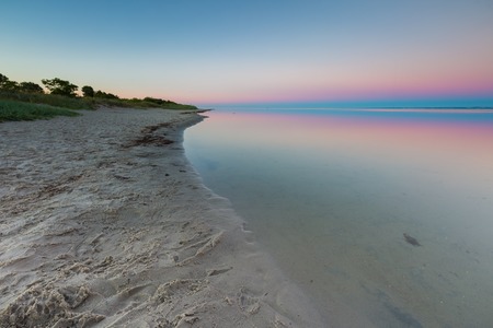 Beautiful beach before sunrise. Landscape of gdanska bay photographed on Jastarnia in Polandの写真素材