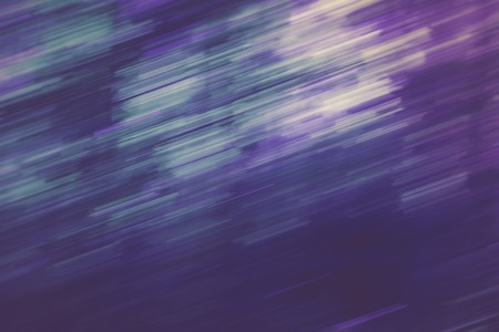 Vintage photo of blurry abstract background of green summer forest photographed on long exposure...