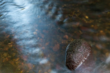 Detail of wild river - water and stone. Wadag river in Olsztyn, Poland.の写真素材