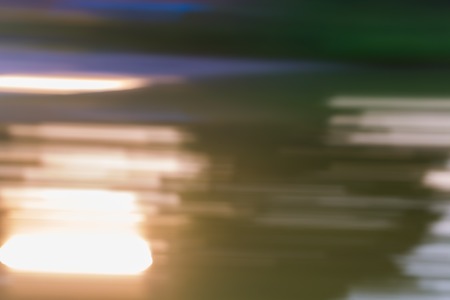 Beautiful colorful bokeh background. Natural defocused background of summer forest or water.の写真素材