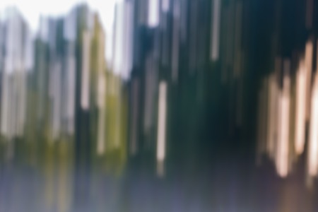 Beautiful colorful bokeh background. Natural defocused background of summer forest or water.の写真素材