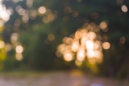 Beautiful colorful bokeh background. Natural defocused background of summer forest or water.の写真素材