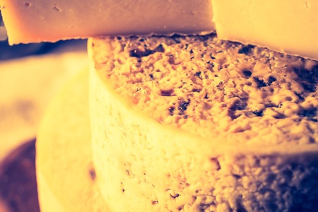 Vintage photo of still life with french goat cheese. Studio shoot with mystic light effect.の写真素材
