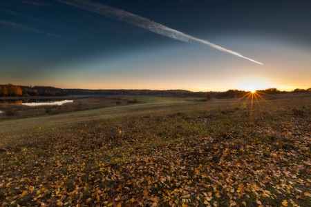 Beautiful autumnal landscape with trees and beautiful countryside photographed at sunset. Amazing dreamy landscape with good light.の写真素材