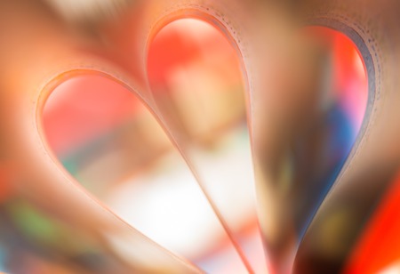 Colorful paper abstraction made with curved paper sheets and colorful lights.の写真素材