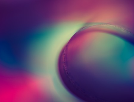Vintage photo of colorful paper abstraction made with curved paper sheets and colorful lights.の写真素材