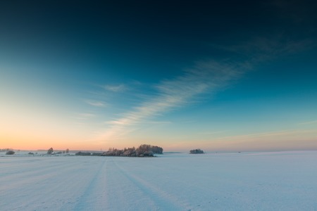 Beautiful cold morning on snowy winter countryside. Polish countryside at snowy winter.
