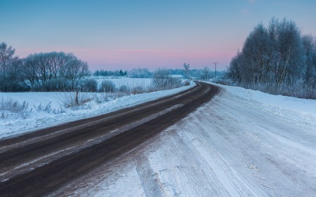 Beautiful cold morning on snowy winter countryside. Polish countryside at snowy winter.の写真素材