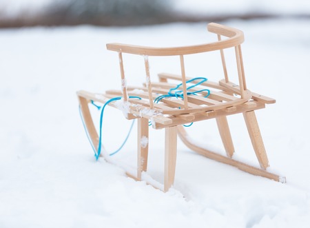 Sled lying on snow in winter landscape. European winter.の写真素材