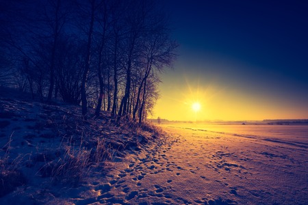 Vintage landscape of winter field in Poland. Beautiful retro landscape.の写真素材