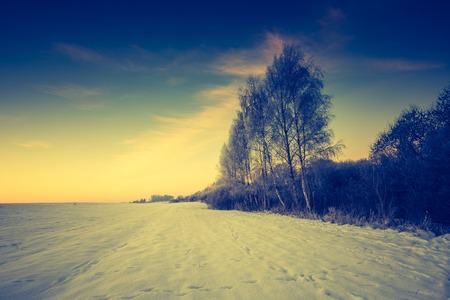 Vintage landscape of winter field in Poland. Beautiful retro landscape.の写真素材