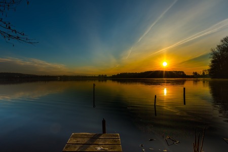 Sunrise over beautiful lake in Mazury lake district. Morning in Poland. Lake alndscape at sunriseの写真素材