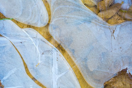 Close up of ice texture on frosted puddle.の写真素材
