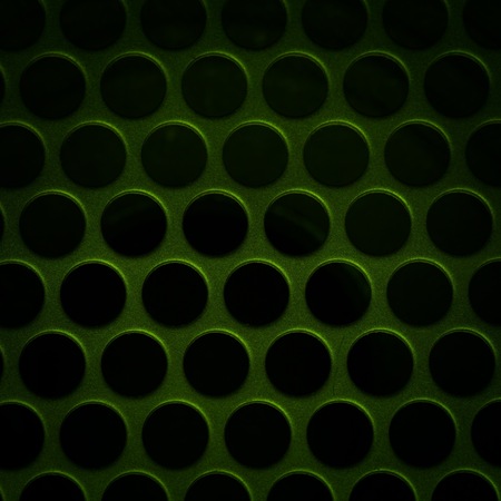 Close up of aluminum speaker. Texture with holes.の写真素材