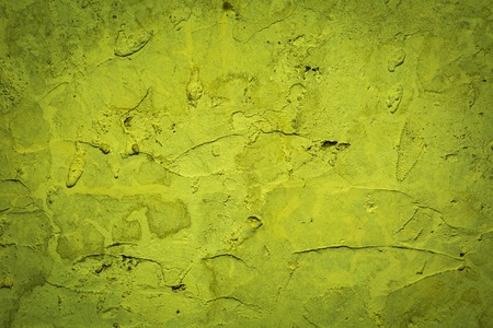 Old destroyed concrete wall with uneven structure. Color wall background.の写真素材