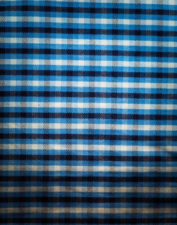 Checkered material background. Close up of kitchen tablecloth with checks.の写真素材