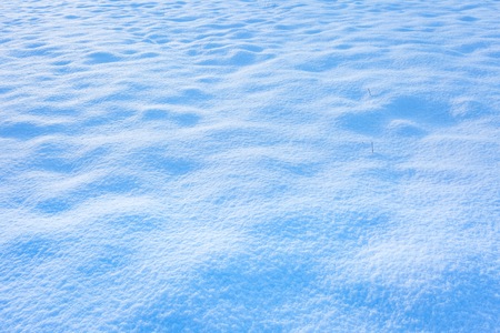 Snow background. Close up of fresh snow lying on field. Christmas backgroundの写真素材