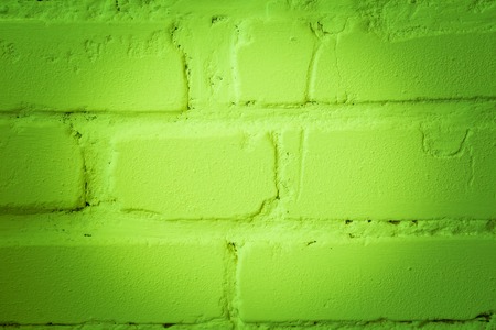 Brickwall painted. Close up of old brick wall with color.の写真素材